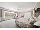 Spacious main bedroom featuring a large window with views, neutral tones, and ample closet space at 236 Saint James Park, Osprey, FL 34229