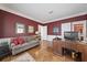 This home office has a large desk and a comfortable plaid couch at 236 Saint James Park, Osprey, FL 34229