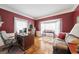 A home office with beautiful built-in shelves and a large picture window for ample light at 236 Saint James Park, Osprey, FL 34229