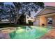 Backyard pool and spa with lush landscaping creating a private oasis at 236 Saint James Park, Osprey, FL 34229