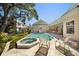 Stunning pool and spa area surrounded by lush landscaping and a spacious patio for relaxation at 236 Saint James Park, Osprey, FL 34229