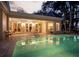 Outdoor pool with covered patio, ceiling fans, and ample seating creating an inviting entertainment space at 236 Saint James Park, Osprey, FL 34229