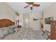 Comfortable bedroom with a ceiling fan, neutral walls, and decor for a relaxing coastal feel at 2871 Royal Palm Dr, North Port, FL 34288