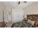 Bedroom featuring closet doors, neutral walls, and access to other rooms in the house at 2871 Royal Palm Dr, North Port, FL 34288