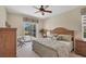 Cozy bedroom featuring neutral tones, a ceiling fan, and a view of the outdoor at 2871 Royal Palm Dr, North Port, FL 34288
