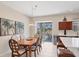Bright dining room featuring elegant furnishings and sliding glass doors to the outdoor patio at 2871 Royal Palm Dr, North Port, FL 34288