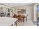 Dining area adjacent to the kitchen and living room at 2871 Royal Palm Dr, North Port, FL 34288