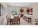 Open dining area with access to the kitchen and outdoor patio at 2871 Royal Palm Dr, North Port, FL 34288