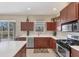Stylish kitchen featuring stainless steel appliances and a breakfast bar at 2871 Royal Palm Dr, North Port, FL 34288