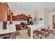 Modern kitchen featuring stainless steel appliances, breakfast bar, and ample cabinet space at 2871 Royal Palm Dr, North Port, FL 34288