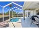 Secluded lanai featuring a spa, lush landscaping, and serene views of the surrounding environment at 2871 Royal Palm Dr, North Port, FL 34288
