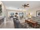 Spacious living room featuring an open layout, tile flooring, and cozy seating arrangements at 2871 Royal Palm Dr, North Port, FL 34288