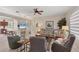 Expansive living room featuring tile floors, a cozy sectional, and open access to the kitchen and dining areas at 2871 Royal Palm Dr, North Port, FL 34288