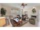 Spacious living area with a fireplace, tile flooring, comfortable furnishings, and open access to other rooms at 2871 Royal Palm Dr, North Port, FL 34288