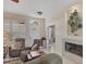 The spacious living area includes a fireplace, comfortable seating, and views of the entryway at 2871 Royal Palm Dr, North Port, FL 34288