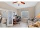 Inviting office featuring a built-in desk, comfortable seating, natural light, and tranquil decor at 2871 Royal Palm Dr, North Port, FL 34288