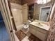 Bathroom with combined shower and tub, toilet, sink vanity, and shelving at 316 Orlando Blvd, Port Charlotte, FL 33954