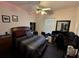 A bedroom with a ceiling fan, a bed, a dresser, and a desk at 316 Orlando Blvd, Port Charlotte, FL 33954