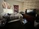 A bedroom with an unmade bed, a dresser, and a map patterned wallpaper at 316 Orlando Blvd, Port Charlotte, FL 33954