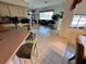 Dining room featuring tile flooring, seating and view of the living room area at 316 Orlando Blvd, Port Charlotte, FL 33954
