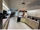 Bright kitchen providing stainless appliances, long countertops, and an open floor plan at 316 Orlando Blvd, Port Charlotte, FL 33954