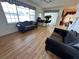 Comfortable living room featuring wood floors and a view into the dining area at 316 Orlando Blvd, Port Charlotte, FL 33954