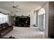 Open living room featuring tile flooring, modern entertainment center and arched entry at 316 Orlando Blvd, Port Charlotte, FL 33954