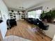 Bright living room with built-in shelving, natural light, and wood floors at 316 Orlando Blvd, Port Charlotte, FL 33954