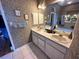 Well-appointed bathroom featuring dual sinks and a large mirror at 316 Orlando Blvd, Port Charlotte, FL 33954