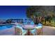 Waterfront backyard features a pool and patio with table, chairs, lounge seating and amazing views at 316 W Royal Flamingo Dr, Sarasota, FL 34236