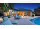 Stunning backyard showcasing a patio with dining, lounge chairs, pool and beautiful landscaping at 316 W Royal Flamingo Dr, Sarasota, FL 34236