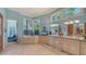 Bathroom with soaking tub, granite counters, dual sinks, and lots of natural light at 316 W Royal Flamingo Dr, Sarasota, FL 34236