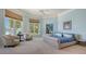 Spacious bedroom features large windows, plush carpet, and cozy sitting area at 316 W Royal Flamingo Dr, Sarasota, FL 34236