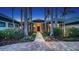 Gorgeous home exterior showcasing meticulous landscaping and a beautiful paver walkway at 316 W Royal Flamingo Dr, Sarasota, FL 34236
