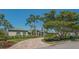 Lovely home exterior with well-maintained landscaping and mature trees enhancing curb appeal at 316 W Royal Flamingo Dr, Sarasota, FL 34236
