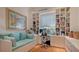 Bright home office with custom built-ins, a desk, and a comfortable daybed at 316 W Royal Flamingo Dr, Sarasota, FL 34236