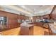Gourmet kitchen with custom cabinets, stainless steel appliances, and granite countertops is perfect for culinary enthusiasts at 316 W Royal Flamingo Dr, Sarasota, FL 34236
