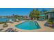 Relaxing pool area with waterfront views and comfortable lounge chairs at 316 W Royal Flamingo Dr, Sarasota, FL 34236