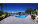 Beautiful backyard featuring a kidney-shaped pool, brick patio, and waterfront views at 316 W Royal Flamingo Dr, Sarasota, FL 34236