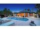 Gorgeous backyard oasis features a large pool, lounge chairs and a covered patio for outdoor entertaining at 316 W Royal Flamingo Dr, Sarasota, FL 34236