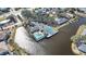 Aerial view of waterfront complex with a pool and tennis courts at 321 108Th W St # 120, Bradenton, FL 34209