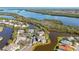 Overhead view shows waterfront homes nestled around the tranquil canals and natural foliage at 321 108Th W St # 120, Bradenton, FL 34209
