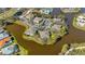Aerial view of homes in a waterfront community with mature trees and lush landscaping at 321 108Th W St # 120, Bradenton, FL 34209