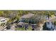 Beautiful aerial view of condo community featuring parking, palm trees, and waterfront at 321 108Th W St # 120, Bradenton, FL 34209