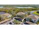 Scenic aerial view of waterfront condos with covered parking and lush landscaping nestled by a tranquil river at 321 108Th W St # 120, Bradenton, FL 34209