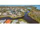 Aerial view of waterfront community along winding canals and waterways at 321 108Th W St # 120, Bradenton, FL 34209