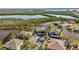 Beautiful aerial view features waterfront condos adjacent to canals, lush vegetation, and ample covered parking at 321 108Th W St # 120, Bradenton, FL 34209