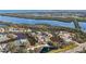 Expansive aerial view captures the waterfront properties, winding waterways, and tropical landscaping of the community at 321 108Th W St # 120, Bradenton, FL 34209