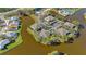 Lovely aerial view showcases condos in waterfront community with pool, parking, and well-maintained landscaping at 321 108Th W St # 120, Bradenton, FL 34209