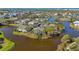 Breathtaking aerial view of waterfront condos nestled amidst trees and tranquil waters in an idyllic setting at 321 108Th W St # 120, Bradenton, FL 34209